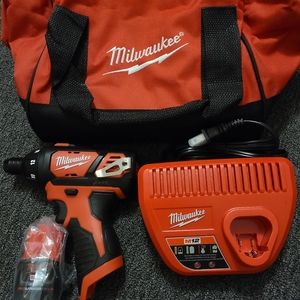 Milwaukee impact gun with bag battery bits and instructions